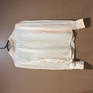 Cream colored blouse with button detail